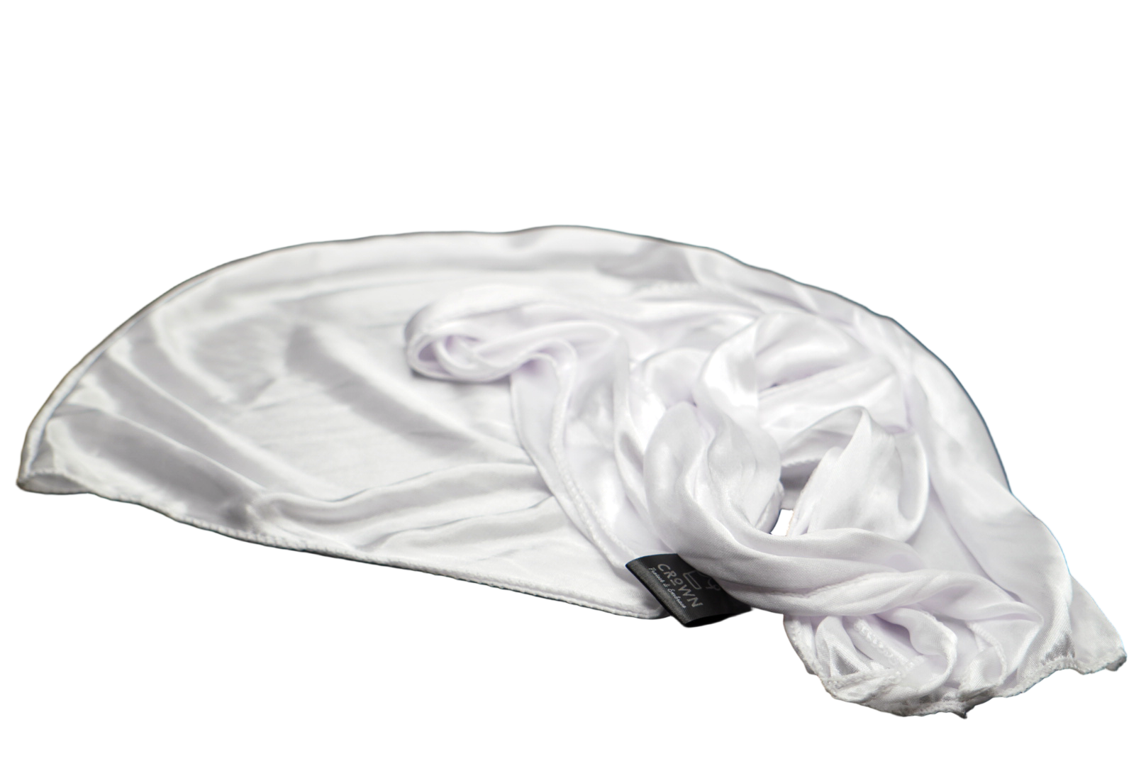 White scarf with a brand tag on a black background