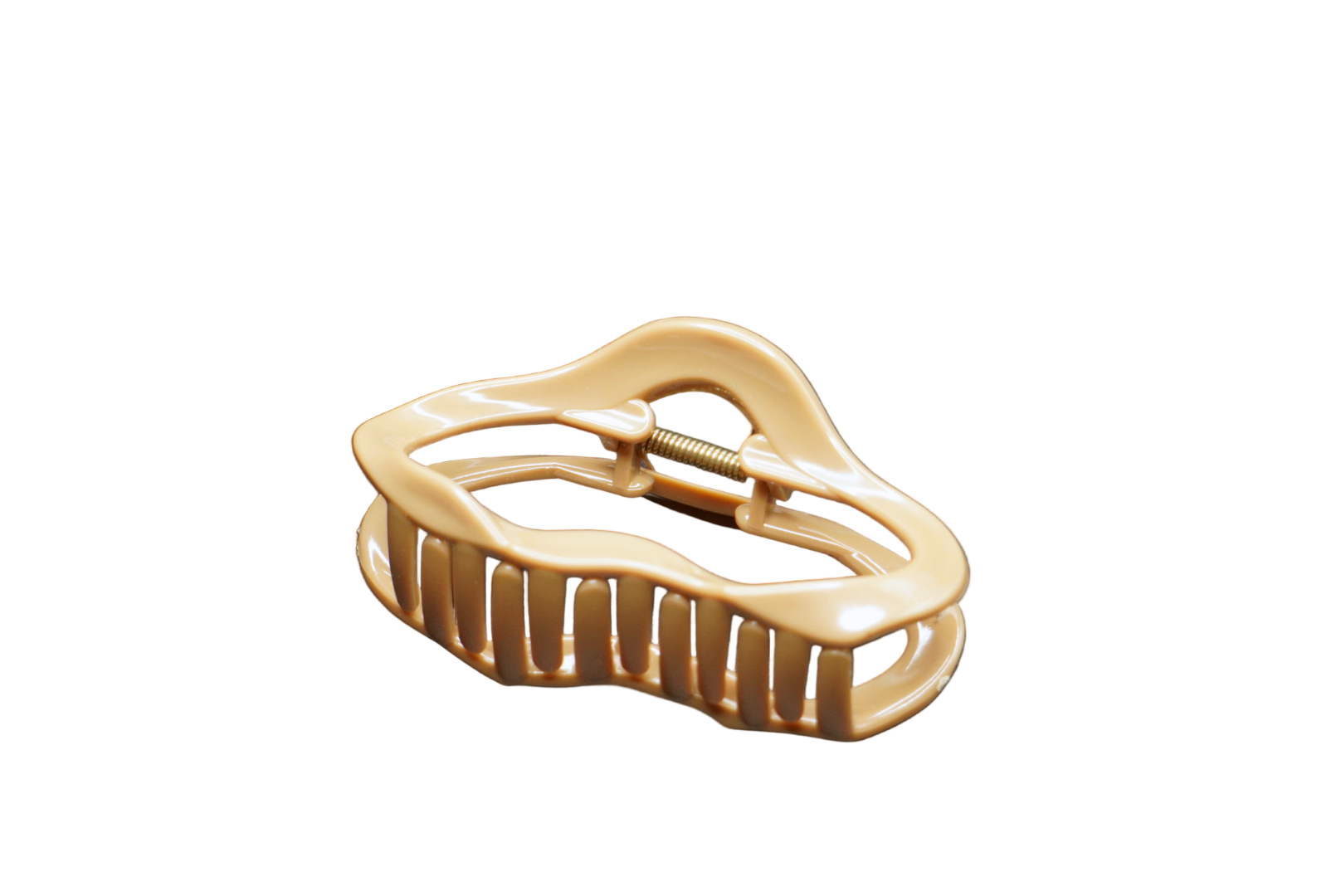 Beige hair clip on a black background