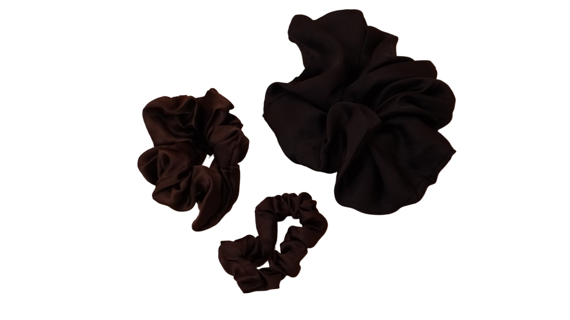 Three black scrunchies on a White background