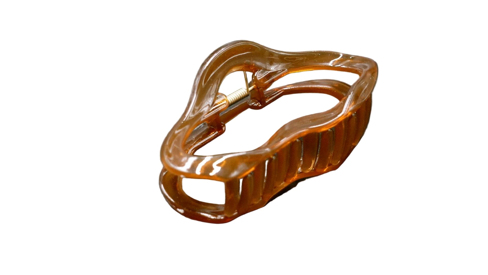 Brown hair clip on a dark gray background