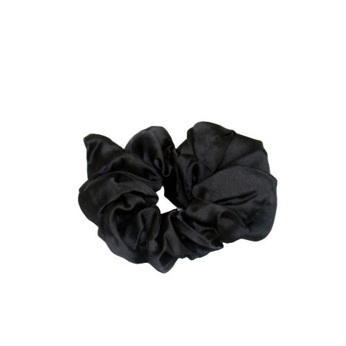 Black scrunchie on a beige background