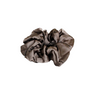 Brown satin scrunchie on a beige background